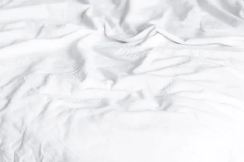 Crumpled white sheets Stock Photos