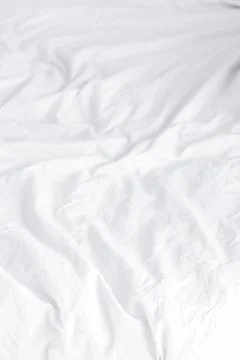 Crumpled white sheets Foto stock