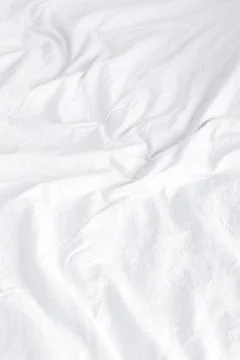 Crumpled white sheets Stock Photos