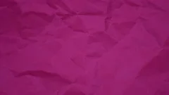 Wrinkle pink paper texture in rotation, Stock Video