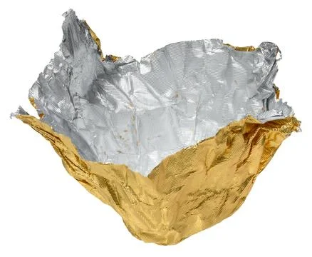 Crumpled yellow foil candy wrapper on isolated background Stock Photos