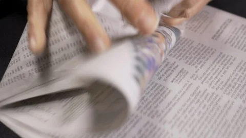 Crumpling newspaper into a ball 4k. Stockbeeldmateriaal 96027760