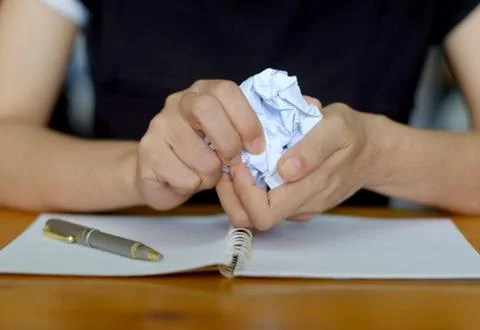 Crumpling the sheet of paperwork. Stock Photos