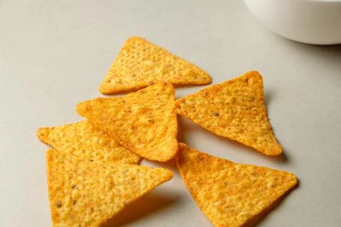 Crunchy nacho chips piled on a table ready for an exciting snack time Stock Photos