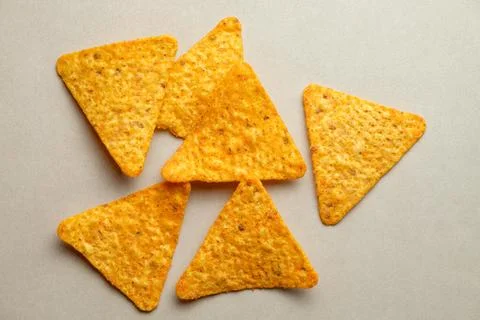 Crunchy triangle chips create a delightful snack experience and party favorite Stock Photos