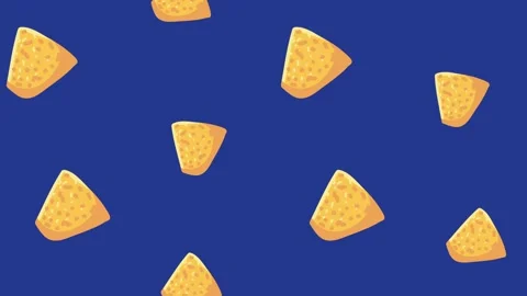 Crunchy yellow nacho chips falling on deep blue background in seamless loop.. Stock Footage 334090355