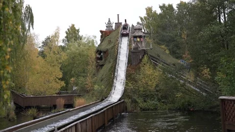 Crush down in water from water roller coaster in amusement park. Stock Footage 247272520