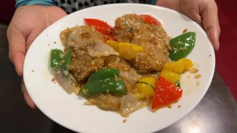 Crushed burnt garlic pepper fish prepared with bell pepper and onion. Video stock 308100714