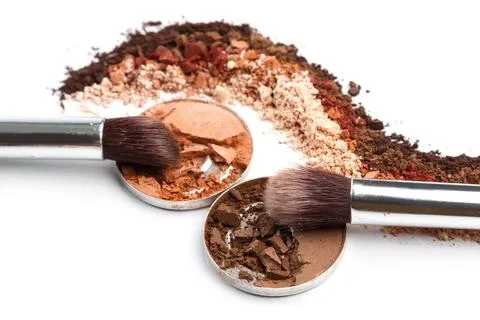 Crushed eyeshadows and make-up brushes Stock Photos