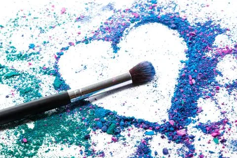 Crushed eyeshadows and make-up brushes Stock Photos