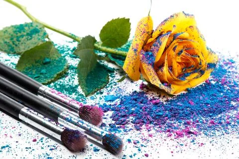Crushed eyeshadows and make-up brushes Stock Photos