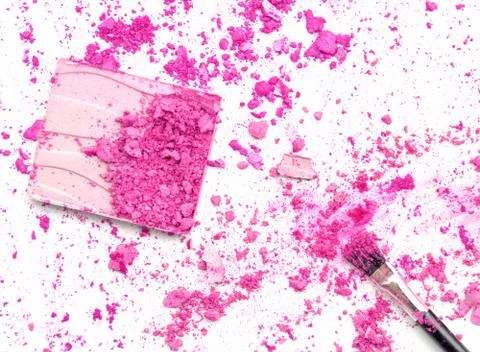 Crushed eyeshadows with box and make up brush as a background Stock Photos