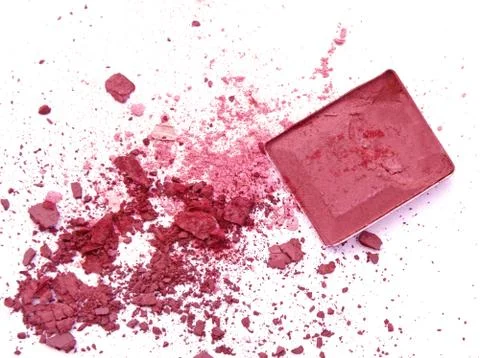 Crushed eyeshadows with box and make up brush as a background Stock-Fotos