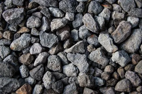 Crushed Grey Stone Texture Background with Rough Angular Gravel Rock Detail.. Stock Photos