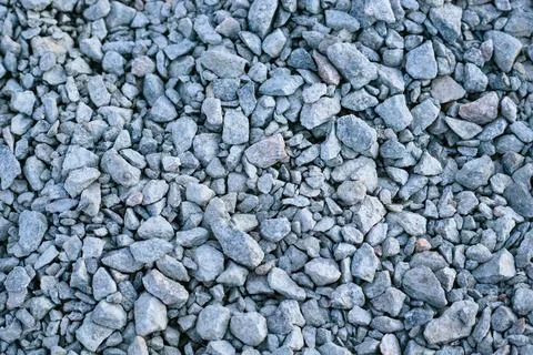 Crushed grey stone texture with various sizes of sharp-edged granite rocks. 写真素材