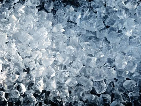 Crushed ice cubes background. Stock Photos