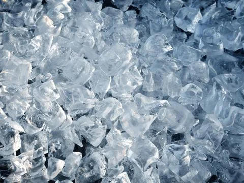 Crushed ice cubes background. Stock Photos