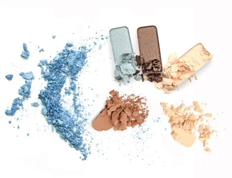 Crushed makeup on white background. The eye shadows. Stock Photos