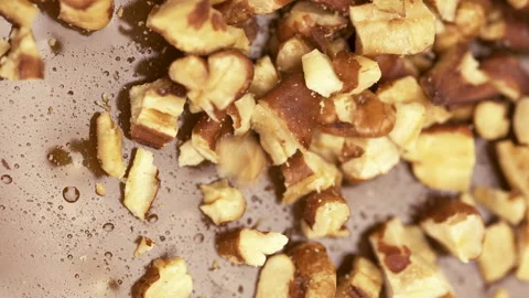 Crushed nuts and caramel close up, homemade candies and confectionery concept 스톡 동영상 282574273