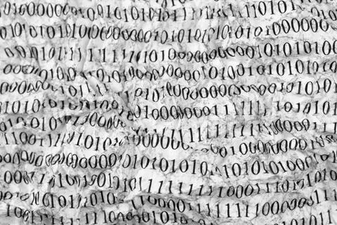 Crushed paper with binary code Foto stock
