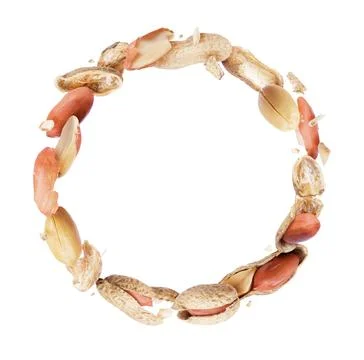 Crushed peanuts in a circular motion on white background Stock Photos
