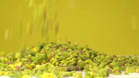Crushed Pistachio Nuts Falling in Macro Extreme Slow Motion Video stock 126704747