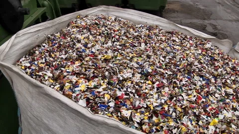 Crushed plastic bottles in the bag prepared for recycling Stock Footage 85475692