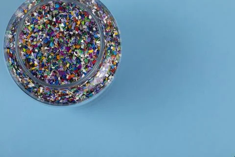 Crushed plastic pellets particles made of multicolored recylced plastics 写真素材