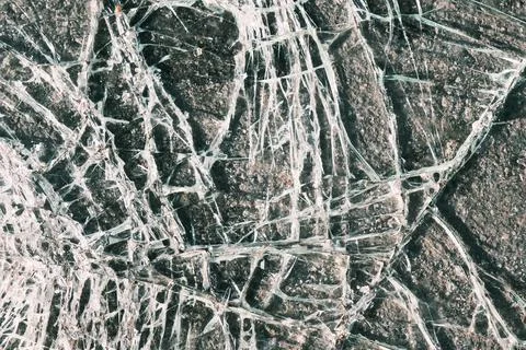 Crushed plastic plexiglass texture, abstract window surface with cracks pattern Stock Photos