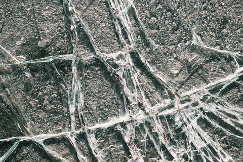 Crushed plastic plexiglass texture, abstract window surface with cracks pattern Stock Photos