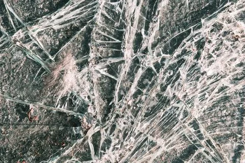 Crushed plastic plexiglass texture, abstract window surface with cracks pattern Stock Photos