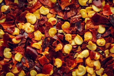 Crushed red chilli pepper macro Background Stock Photos