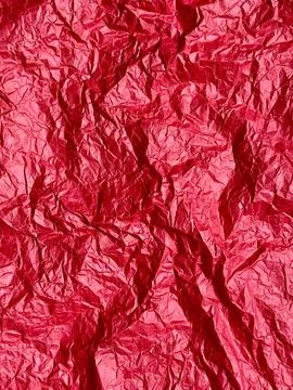 Crushed red paper texture, red background Stock Photos
