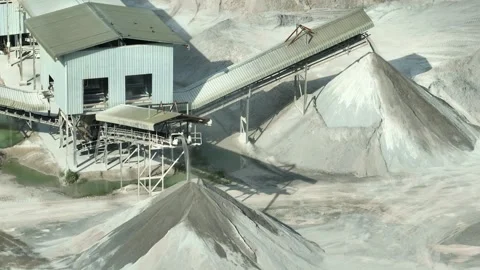 A crushed rock transported by conveyor systems at a quarry site. Видео 340565573