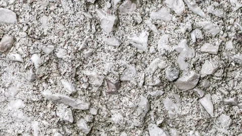 Crushed stone embedded in cement mortar, rough surface, background, moving .. 스톡 동영상 256328600