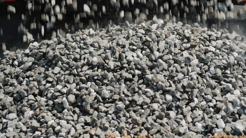 Crushed stone is poured from the body. Construction of roads and building Stock Footage 89090861