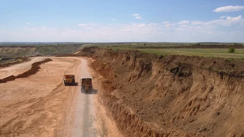 Crushed stone quarry, two trucks, aerial view Video stock 120695501