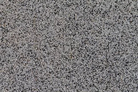 The crushed stone surface of the wall. Close up. Background. Stock Photos