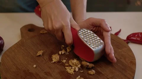 Crushed Walnuts. Chopping walnuts on a cutting board 動画素材 155124847