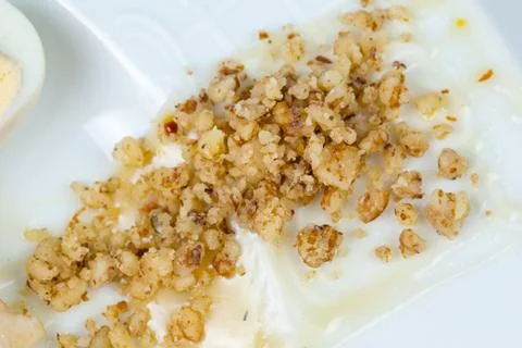 Crushed walnuts with sauce Stock Photos