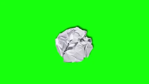 Crushed white paper ball isolated on bright green background Stock Footage 342220193