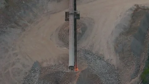 Crusher conveyor belt quarry active operations extensive piles crushed stones Stockbeeldmateriaal 313407346