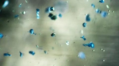 Crushing and agglomeration of plastic particles on water surface. Stock Photos