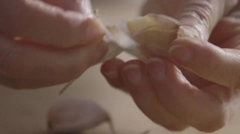Crushing and peeling garlic Stock Footage 64046792