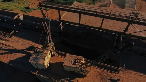 Crushing and sizing plant. Processing of mineral resources. Excavator unloads Stock Footage 74194210