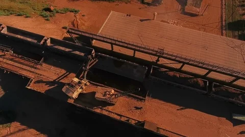 Crushing and sizing plant. Processing of mineral resources. Excavator unloads Stock Footage 74194681