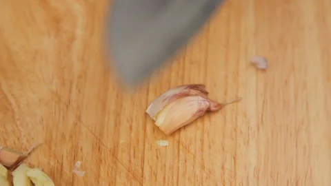 Crushing garlic using a knife Stock Footage 88818550