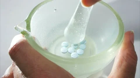 Crushing pills Stock Footage 11148146
