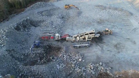 Crushing plant processing rocks in a quarry in Finland during spring Stock Footage 338262034
