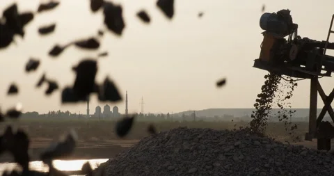 Crushing screening in open-pit mining. Sorted rocks move on conveyor line, fall Stock Footage 290115667